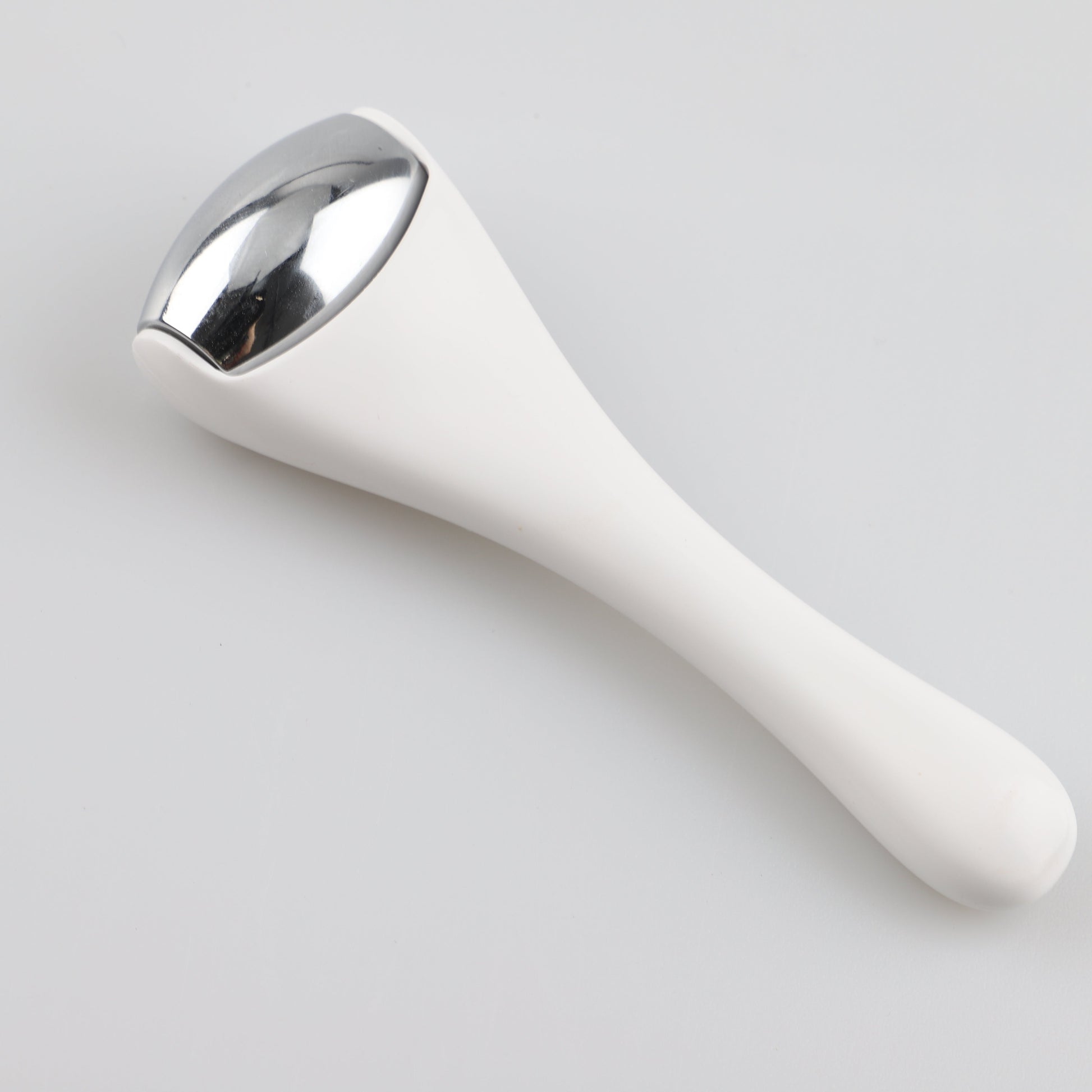 Ice roller used on the neck for a cooling massage